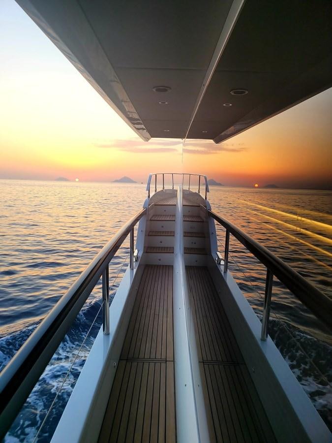 a long dock leading to the ocean aboard ELYSIUM Yacht for Sale