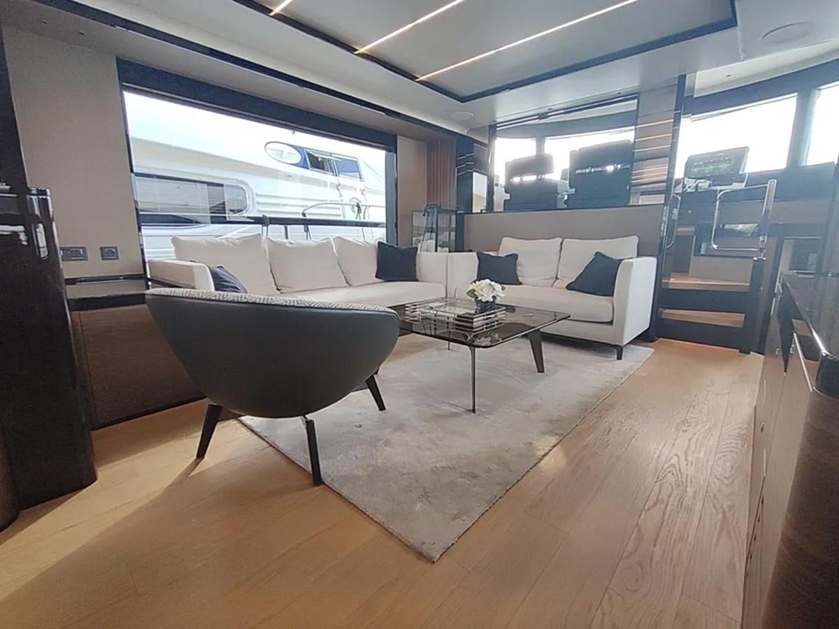 a living room with a large window aboard ELYSIUM Yacht for Sale