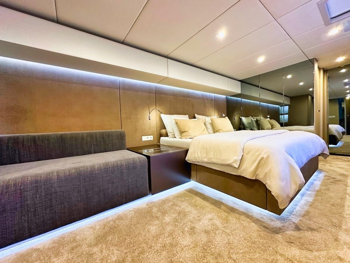 a room with a couch and a bed aboard NALA ONE Yacht for Sale