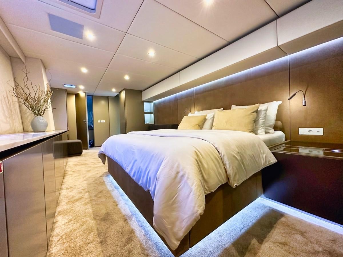 a large hotel room with a large bed aboard NALA ONE Yacht for Sale