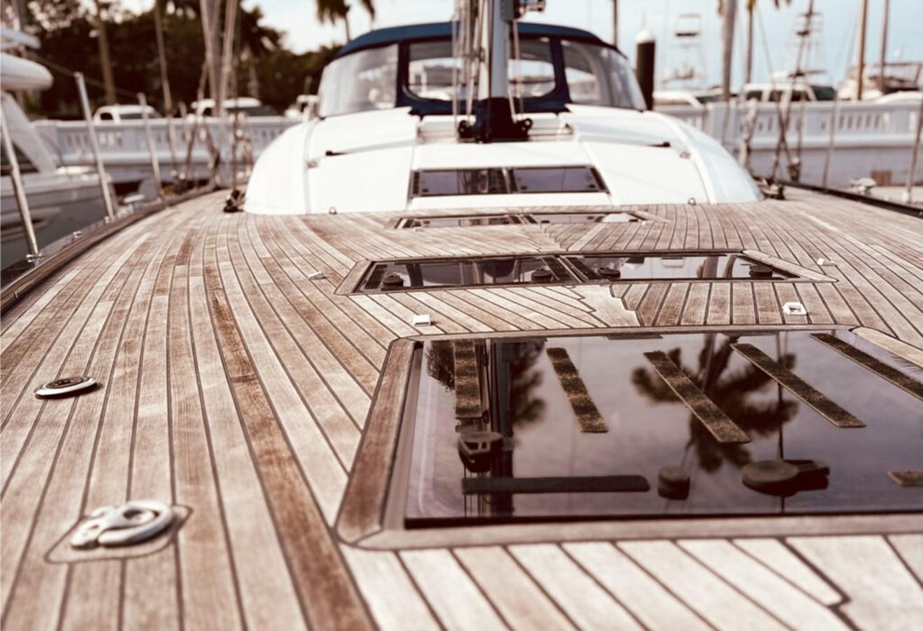 a boat on a dock aboard 2021 JEANNEAU 64 – “MAH NA MAH NA” Yacht for Sale