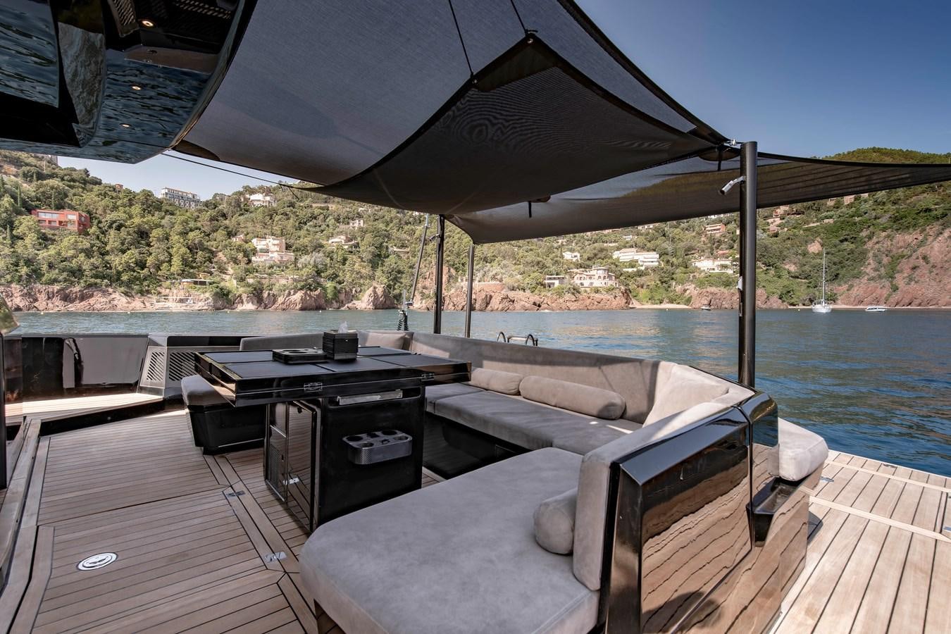 a deck with a large bed and a large body of water aboard MATARIKI Yacht for Sale