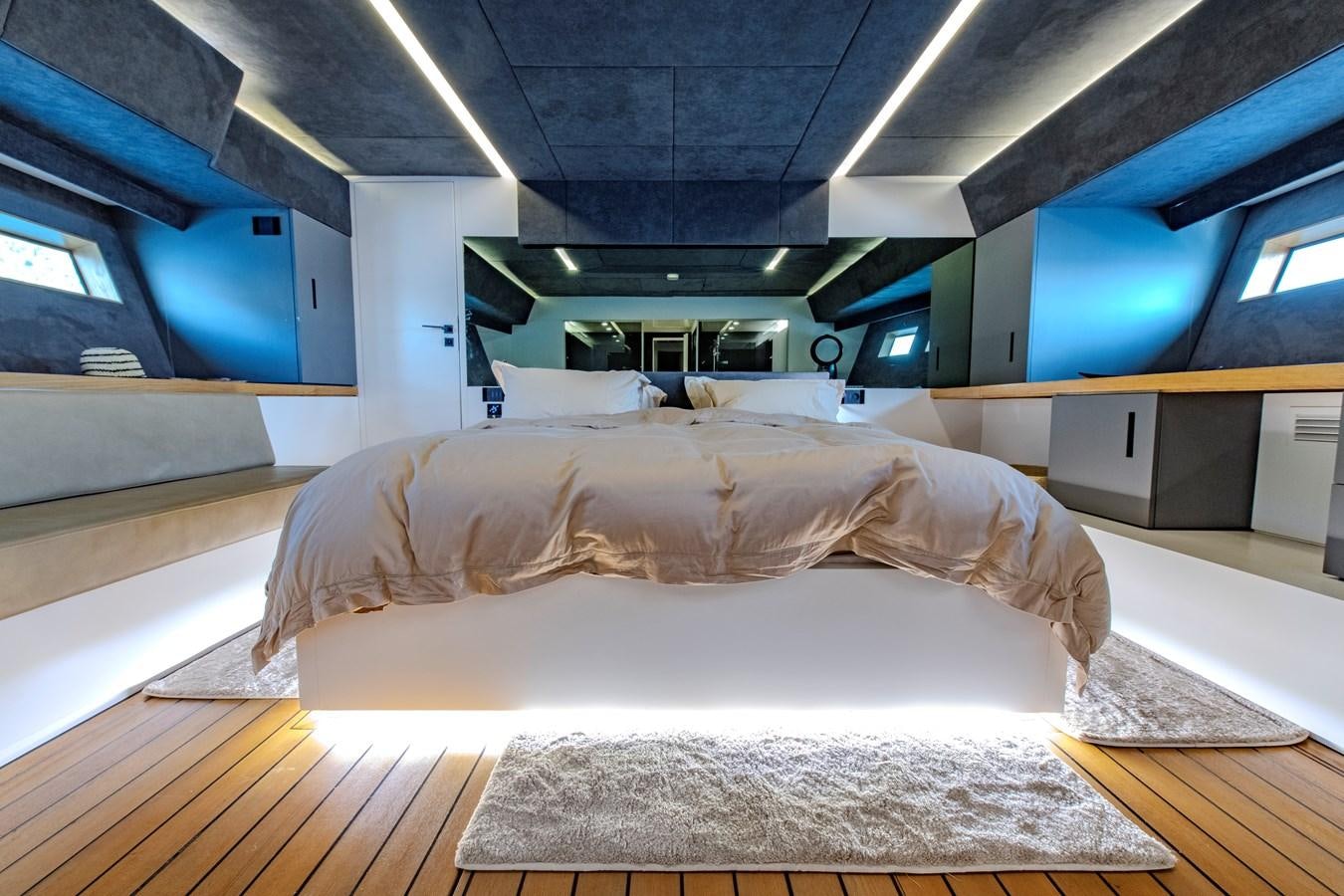 a room with a bed and a desk aboard MATARIKI Yacht for Sale