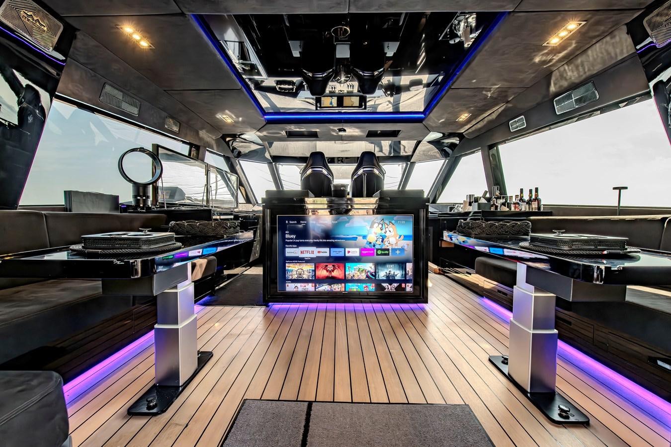 a room with a large screen and a large pool table aboard MATARIKI Yacht for Sale