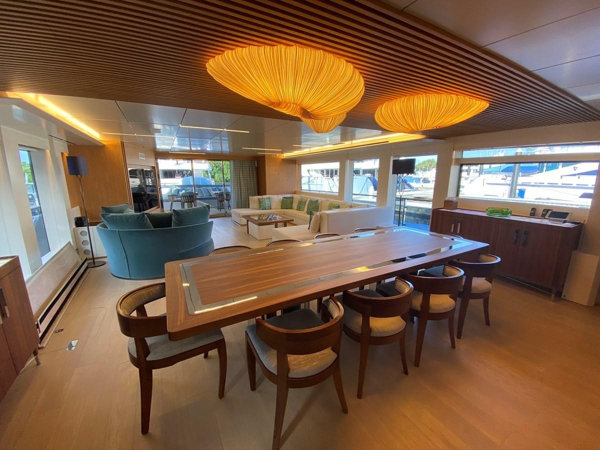 a large kitchen with a table and chairs aboard CALLIOPE Yacht for Sale