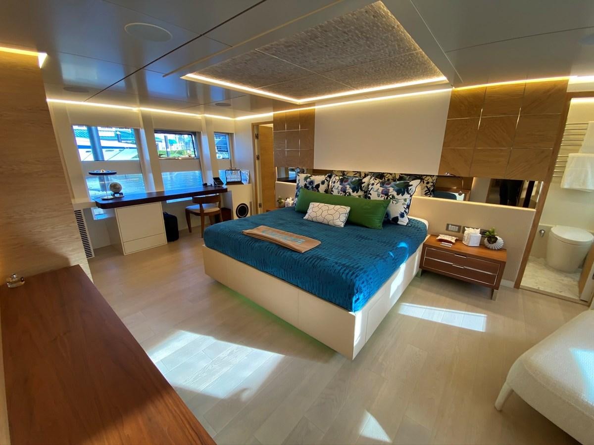 a room with a bed and a desk aboard CALLIOPE Yacht for Sale