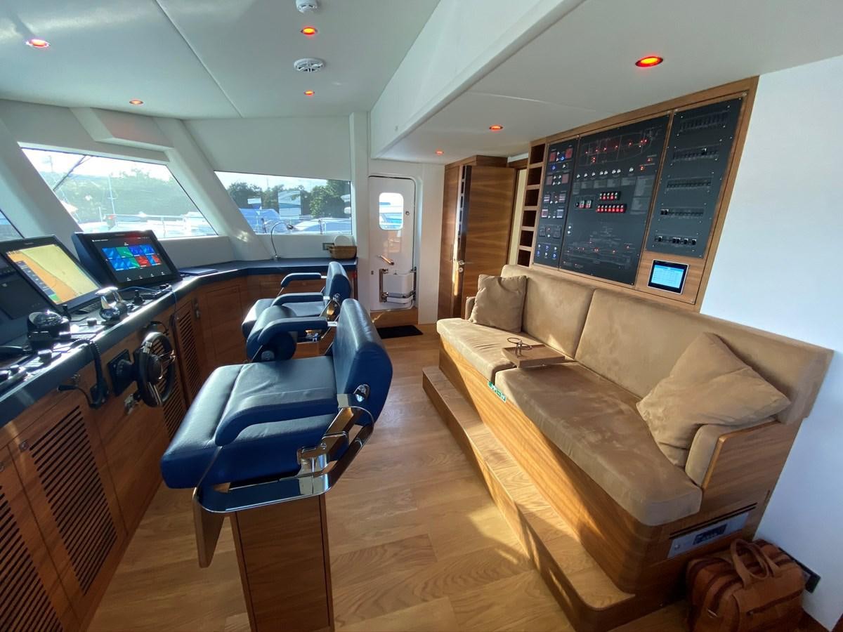 a living room with a couch and a table aboard CALLIOPE Yacht for Sale