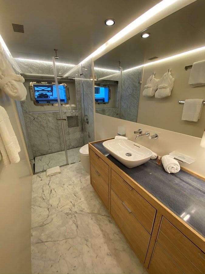 a bathroom with a countertop sink and a mirror aboard CALLIOPE Yacht for Sale