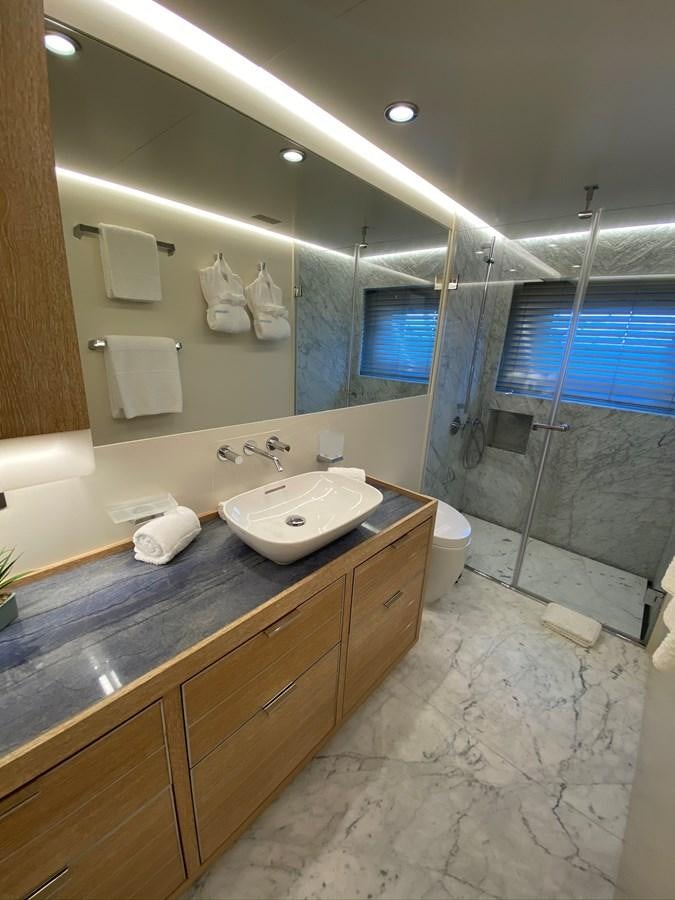a bathroom with a sink and a mirror aboard CALLIOPE Yacht for Sale