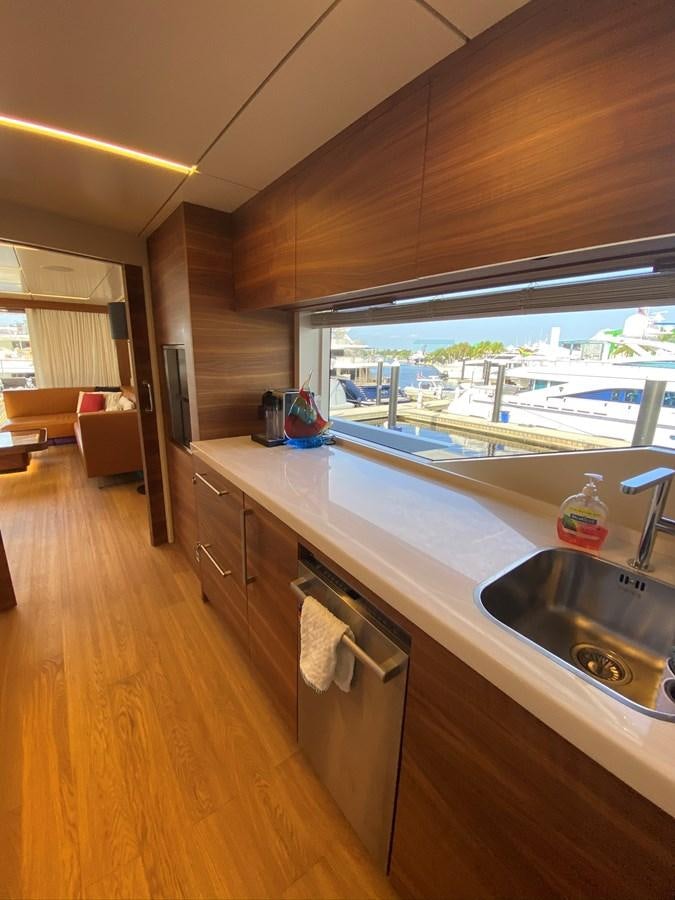 a kitchen with a large window aboard CALLIOPE Yacht for Sale