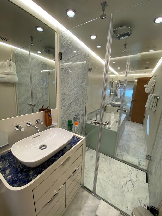 a bathroom with a large mirror aboard CALLIOPE Yacht for Sale