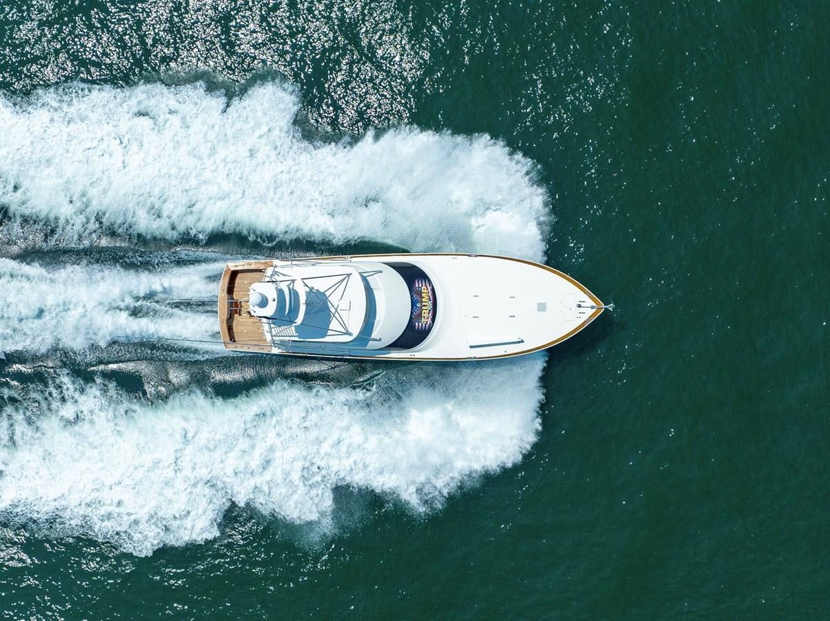 a beer can on a surfboard in the ocean aboard LIFE IS GOOD Yacht for Sale