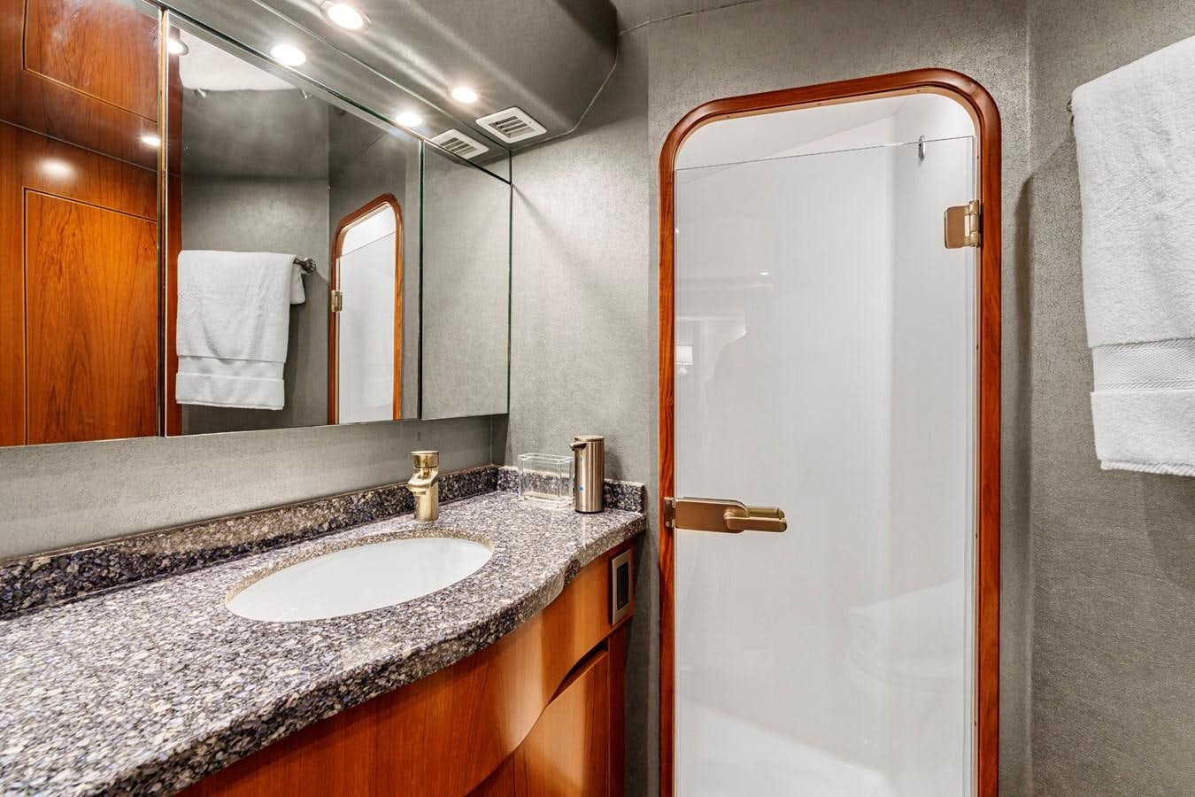 a bathroom with a large mirror aboard LIFE IS GOOD Yacht for Sale