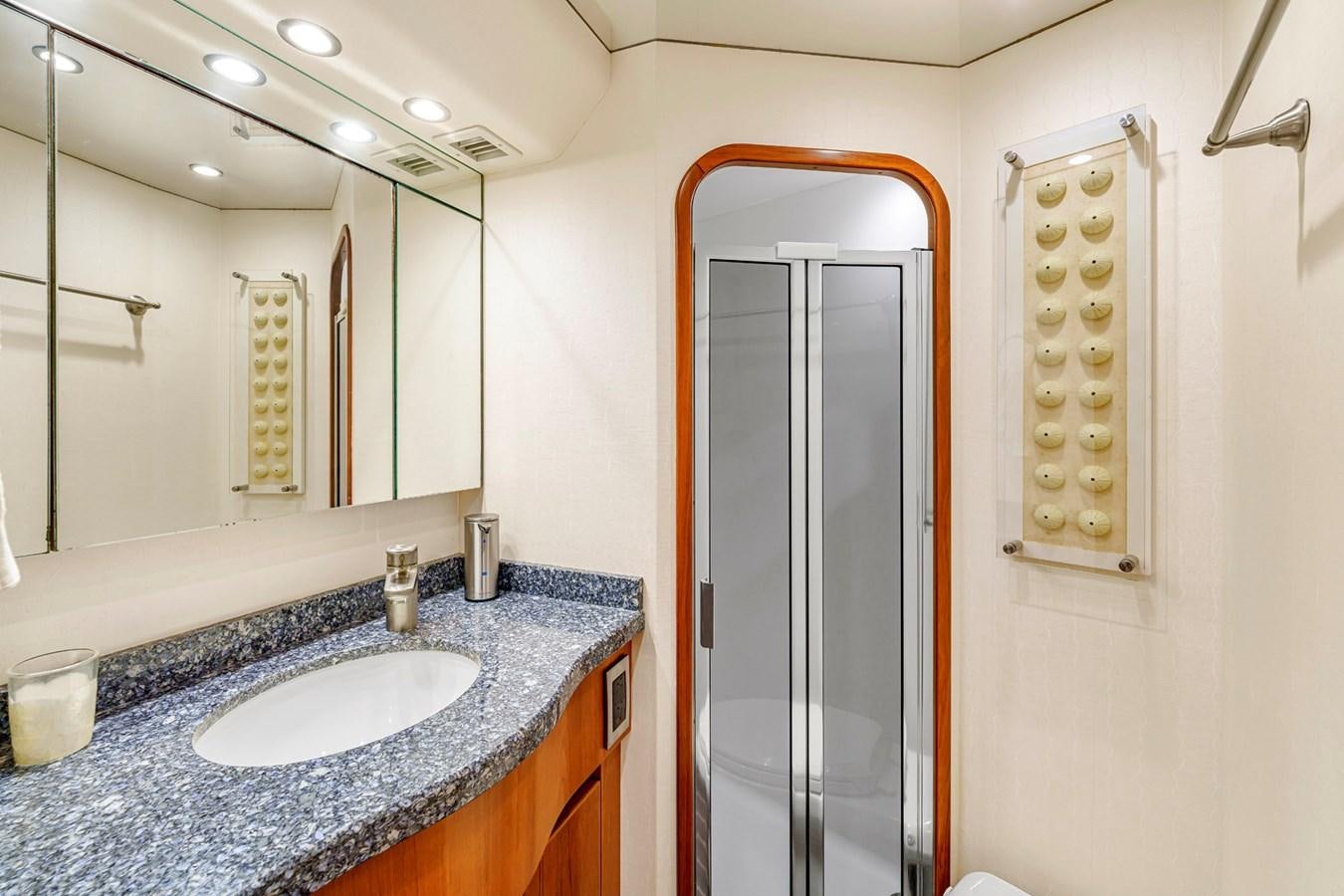 a bathroom with a sink and a mirror aboard LIFE IS GOOD Yacht for Sale