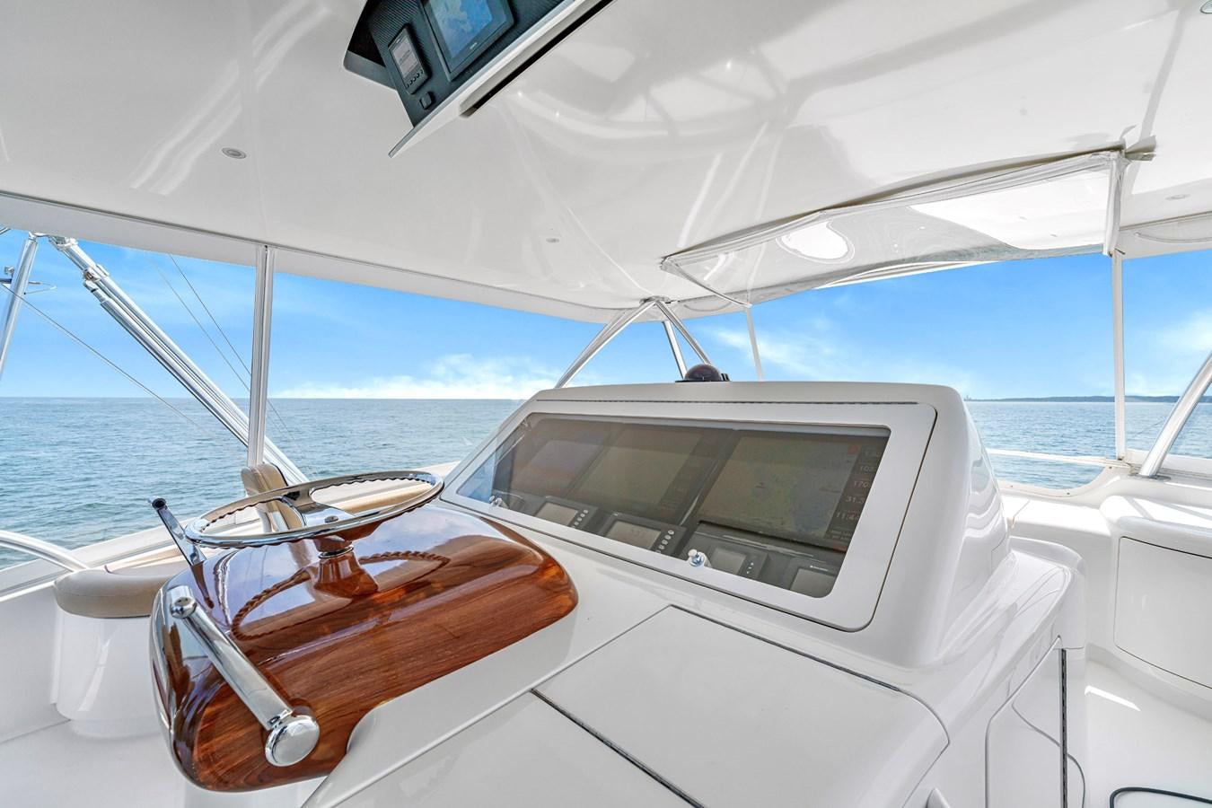 a boat with a steering wheel aboard LIFE IS GOOD Yacht for Sale