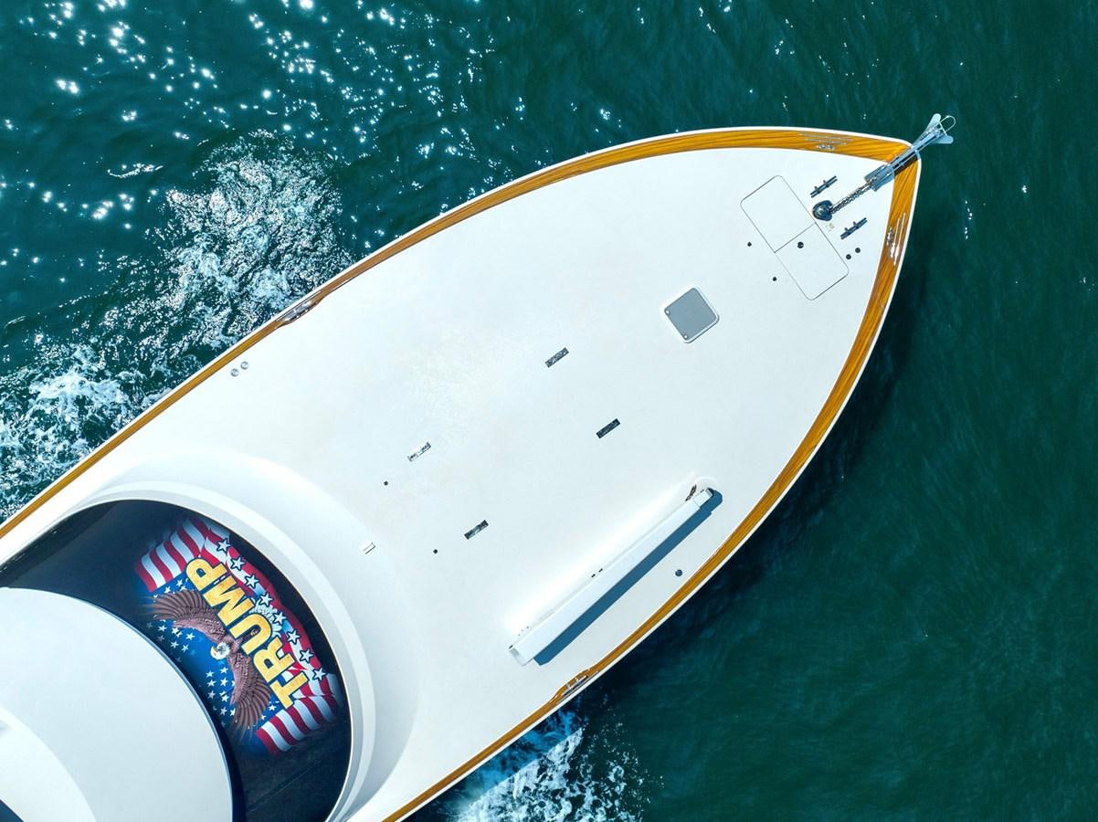 a white and yellow sports car aboard LIFE IS GOOD Yacht for Sale