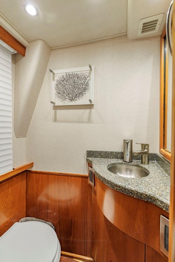 a bathroom with a sink and a toilet aboard LIFE IS GOOD Yacht for Sale