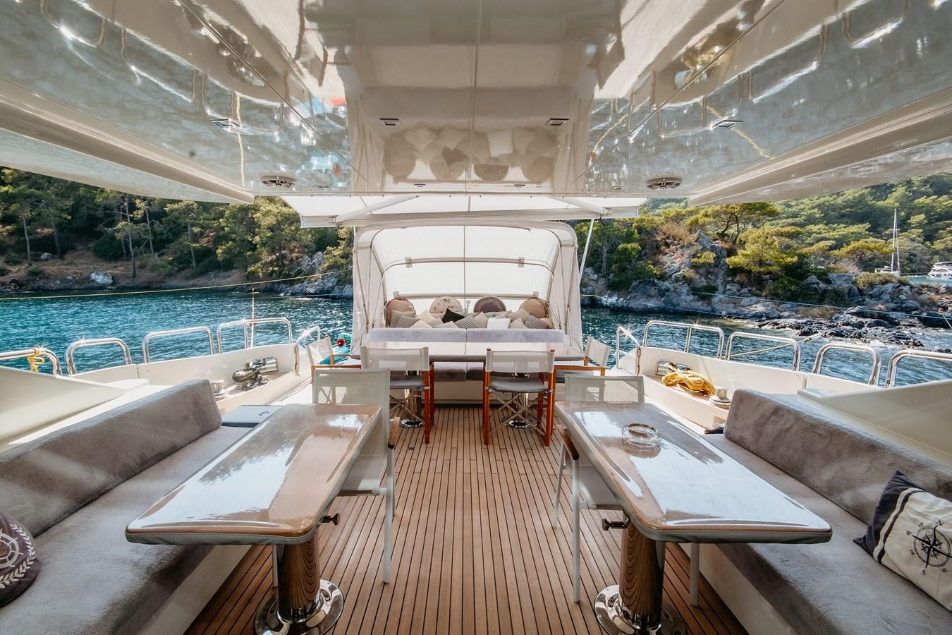 a room with a pool and a table and chairs aboard AZIMUT 86S Yacht for Sale