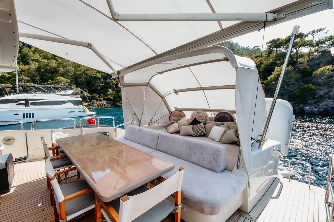 a couch and a table on a boat aboard AZIMUT 86S Yacht for Sale