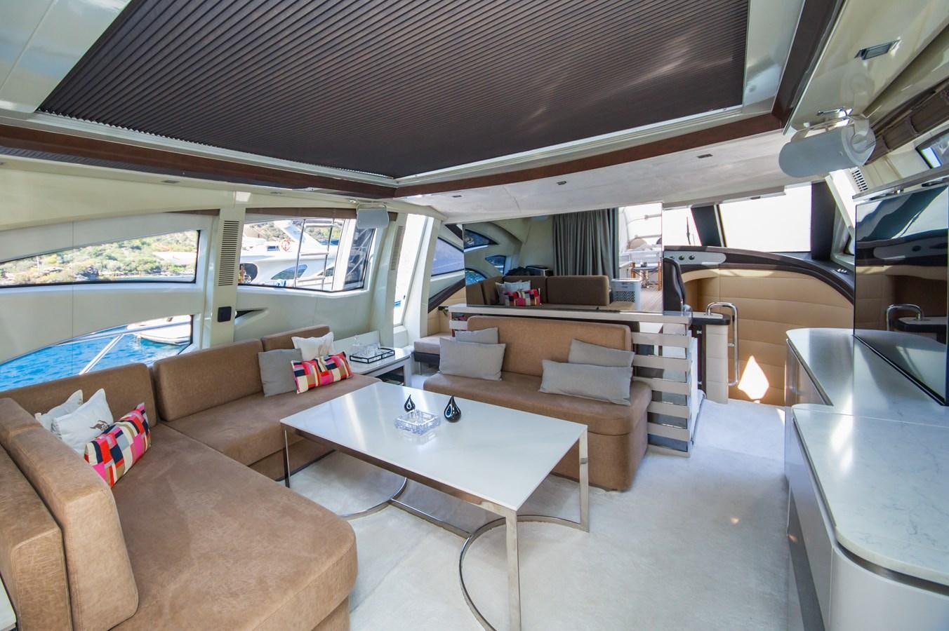 a living room with a couch and a table aboard AZIMUT 86S Yacht for Sale