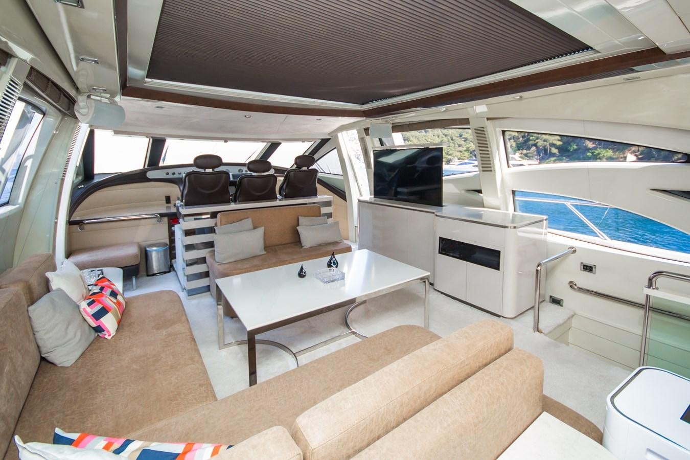 a boat with a table and chairs aboard AZIMUT 86S Yacht for Sale