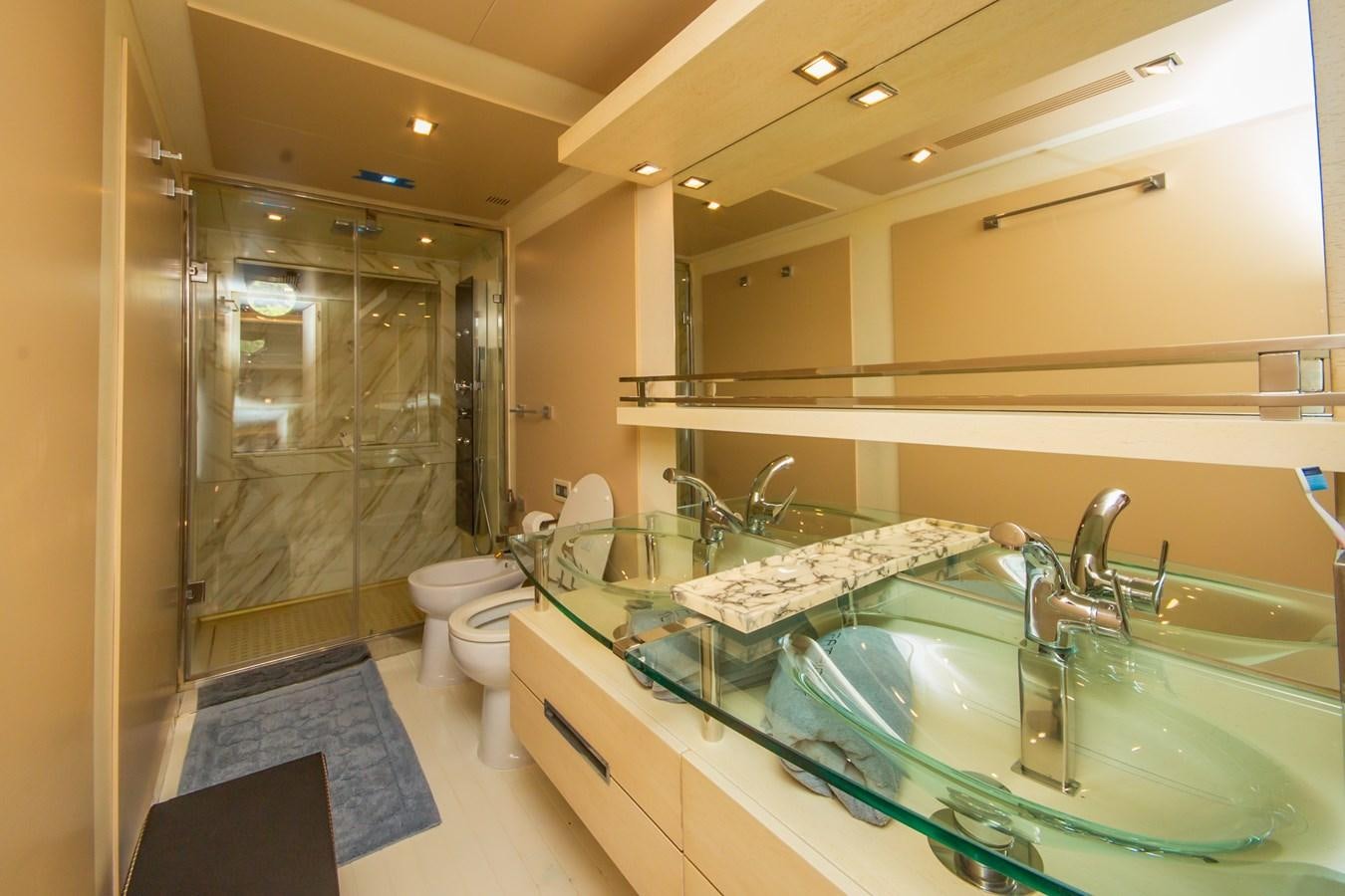 a bathroom with a glass shower aboard AZIMUT 86S Yacht for Sale