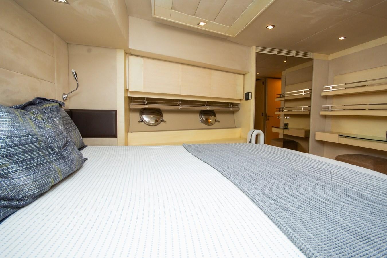 a bed in a room aboard AZIMUT 86S Yacht for Sale