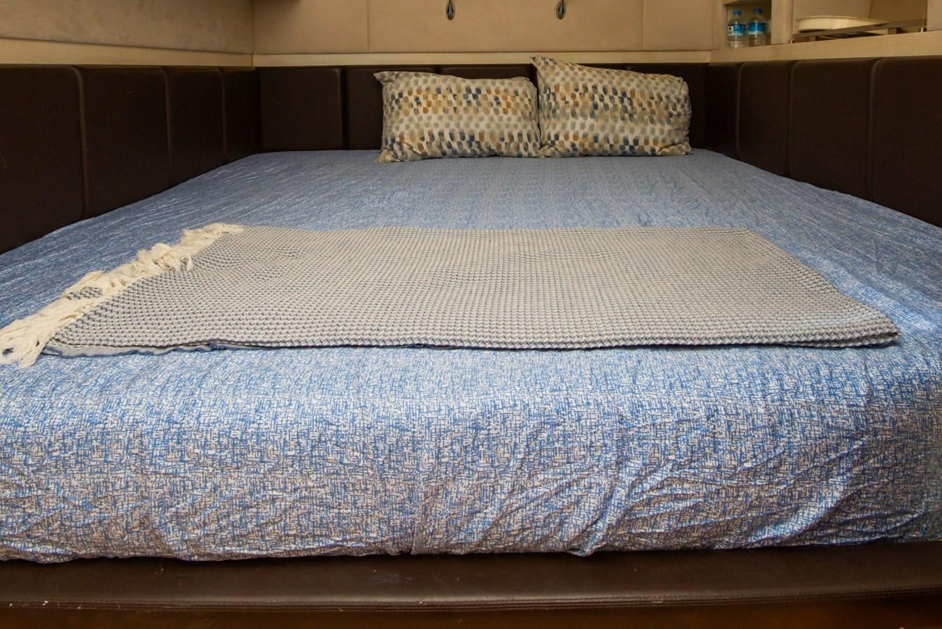 a bed with pillows aboard AZIMUT 86S Yacht for Sale