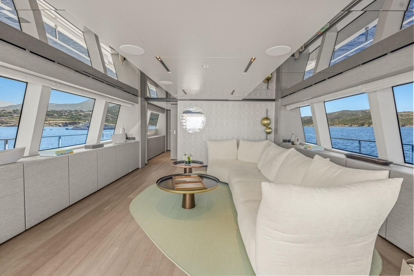 a living room with a couch and a table aboard BUONGIORNO Yacht for Sale