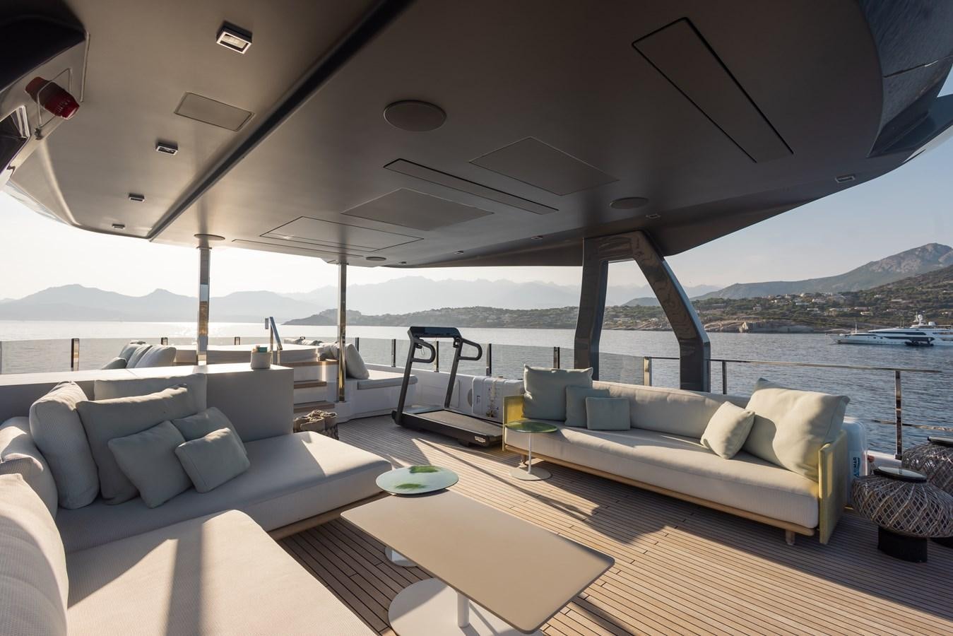 a living room with a large balcony aboard BUONGIORNO Yacht for Sale