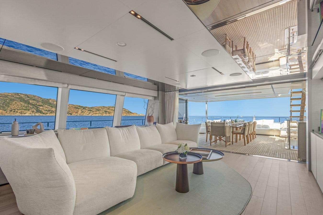a living room with a large window aboard BUONGIORNO Yacht for Sale