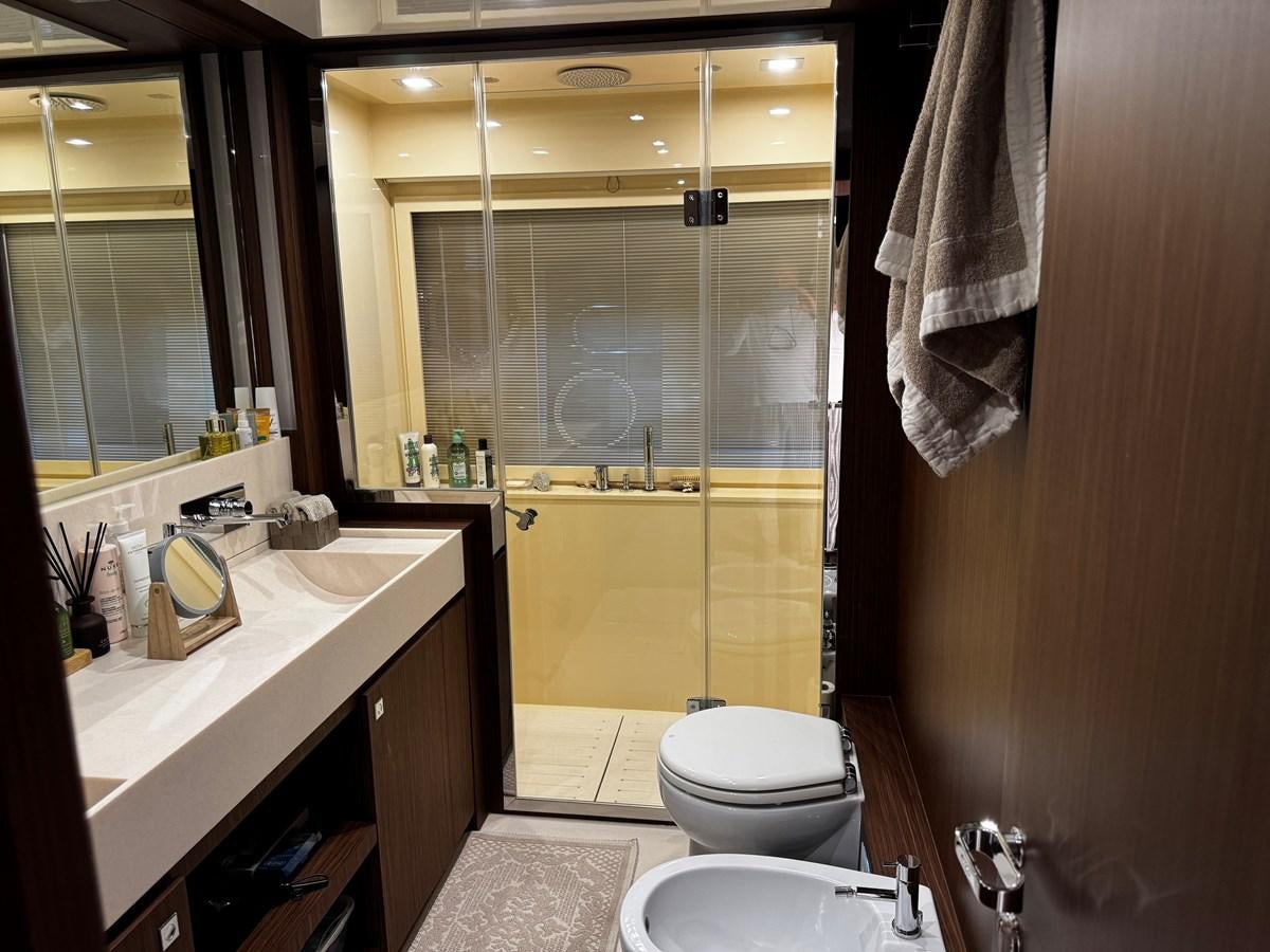 a bathroom with a glass shower door aboard M Yacht for Sale