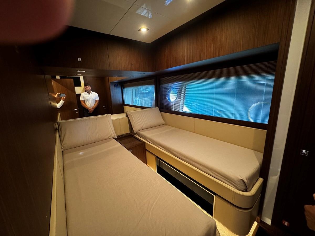 a room with a couch and a television aboard M Yacht for Sale
