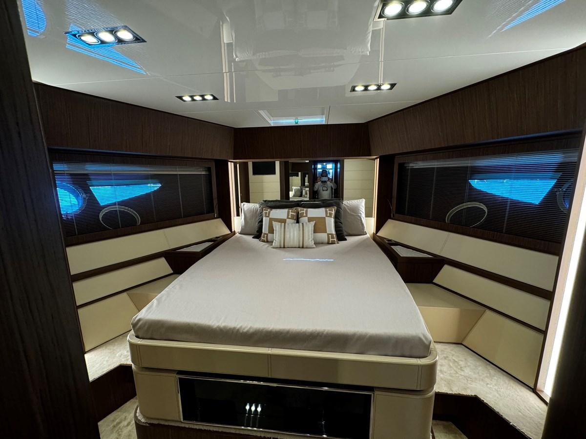 a room with a bed and a television aboard M Yacht for Sale