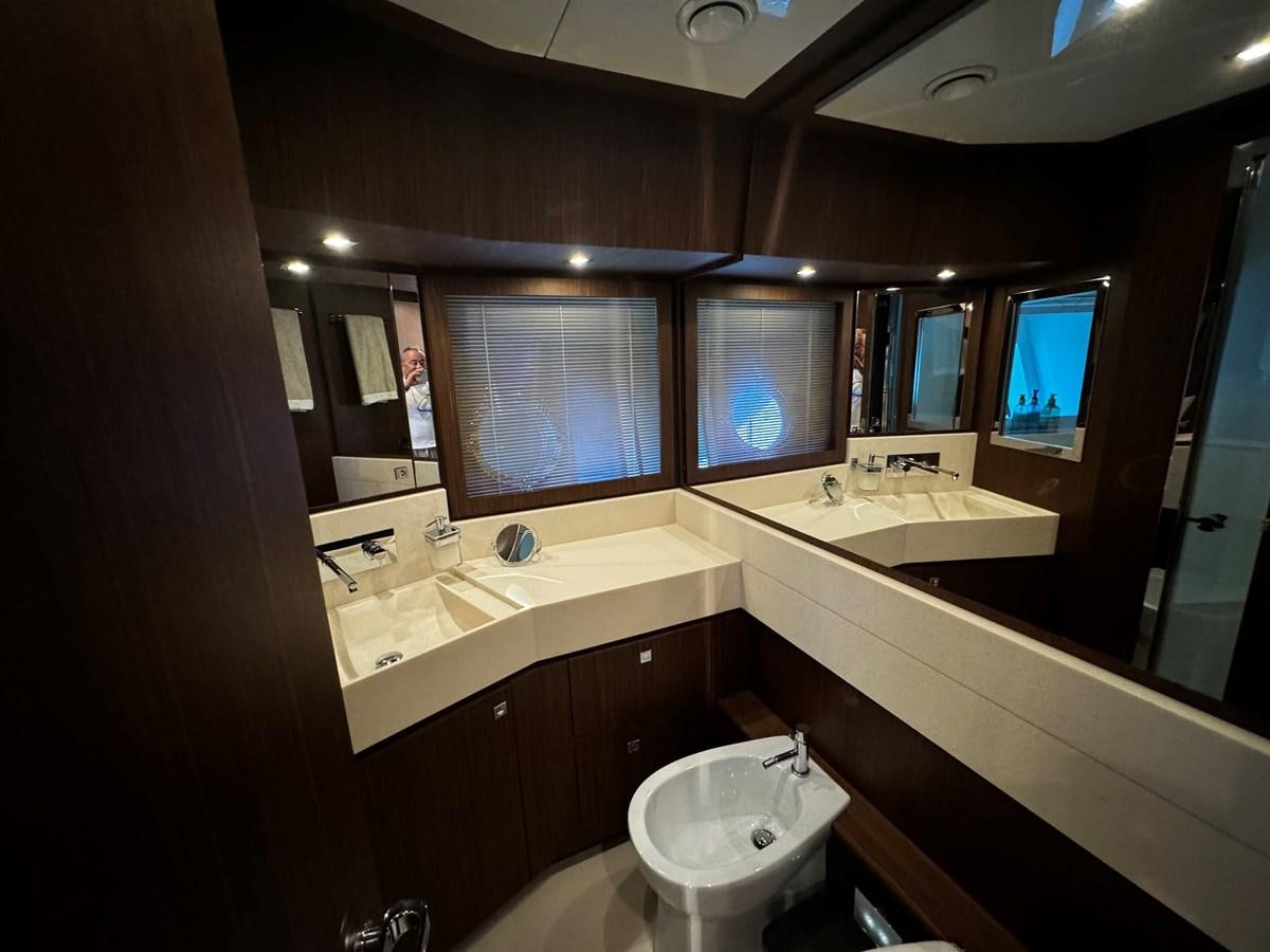 a bathroom with a sink and a mirror aboard M Yacht for Sale