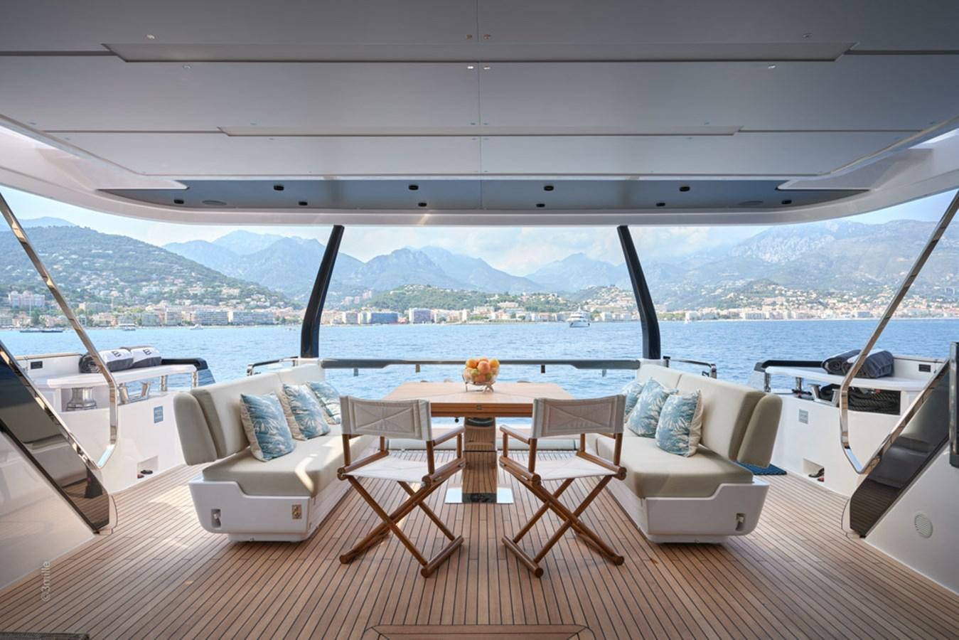 a room with a table and chairs aboard H&CO Yacht for Sale