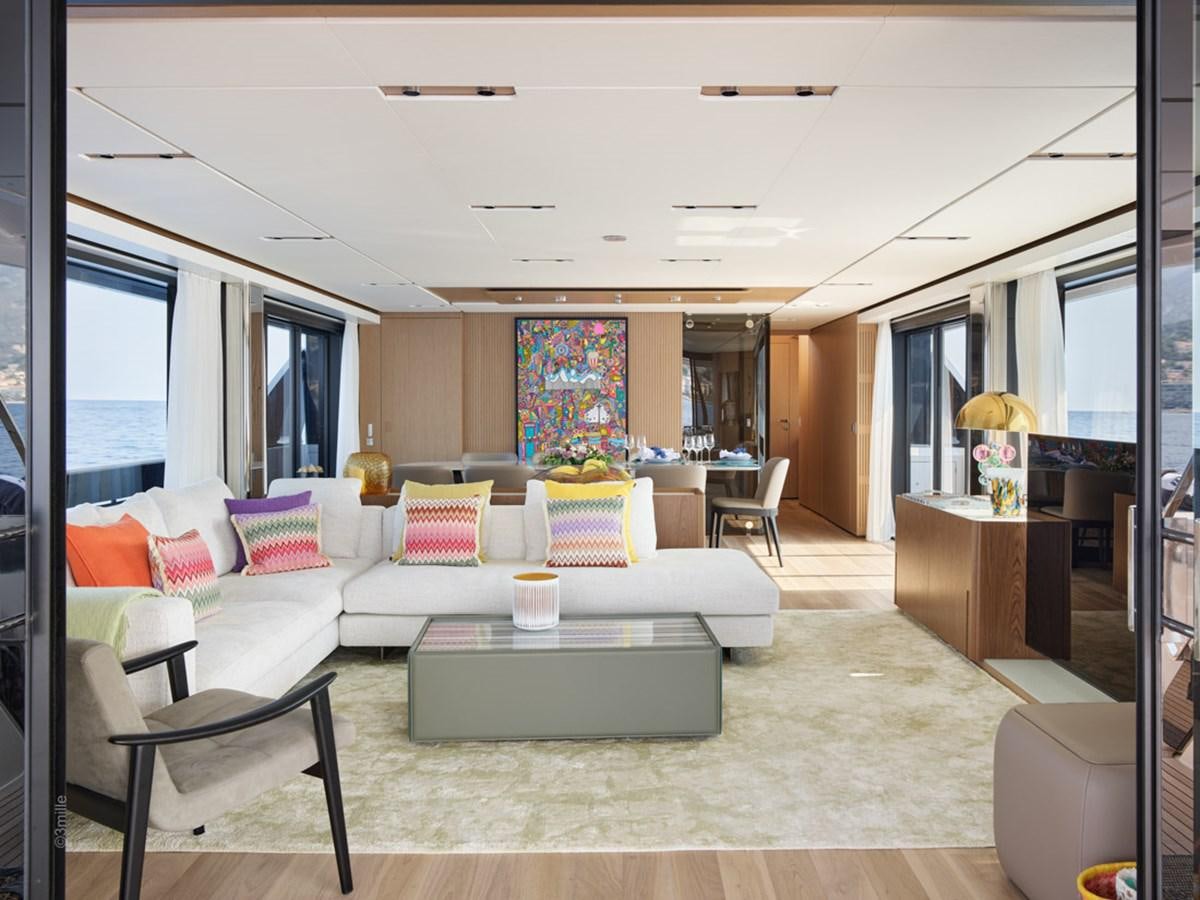 a living room with a large window aboard H&CO Yacht for Sale