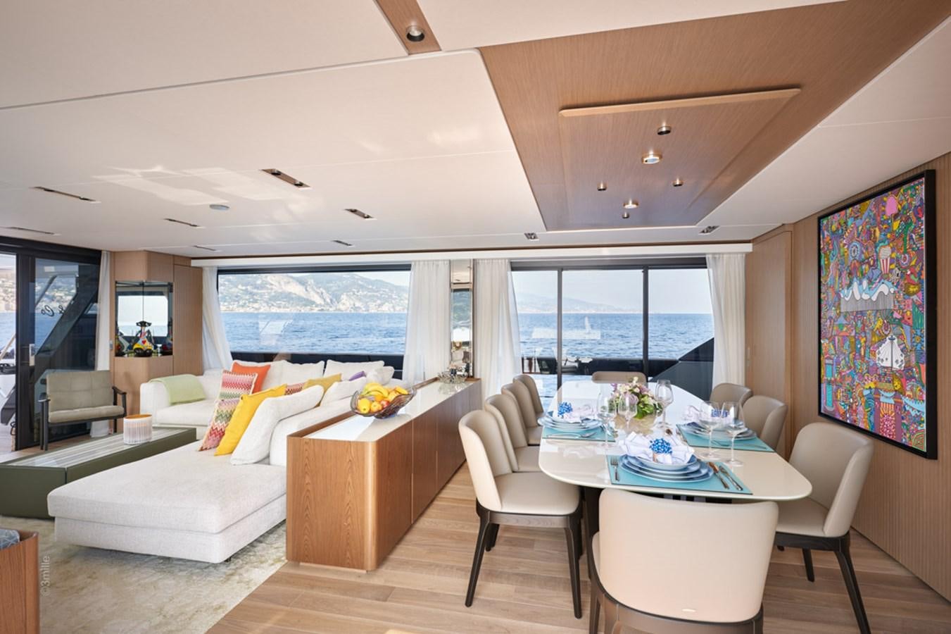 a living room with a large window aboard H&CO Yacht for Sale