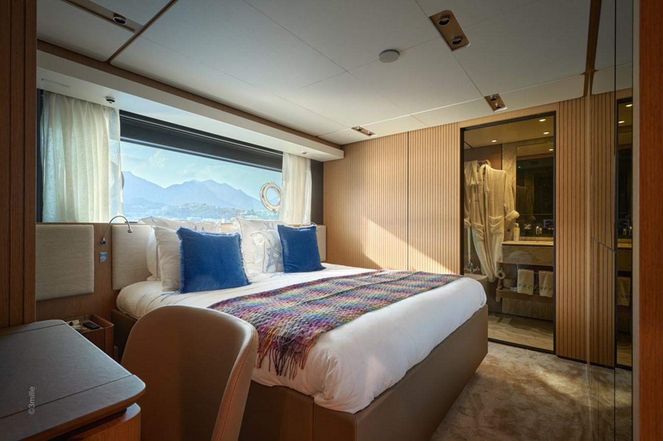 a room with a bed and a window aboard H&CO Yacht for Sale