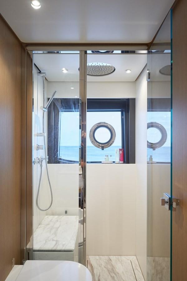 a bathroom with a sink and a mirror aboard H&CO Yacht for Sale