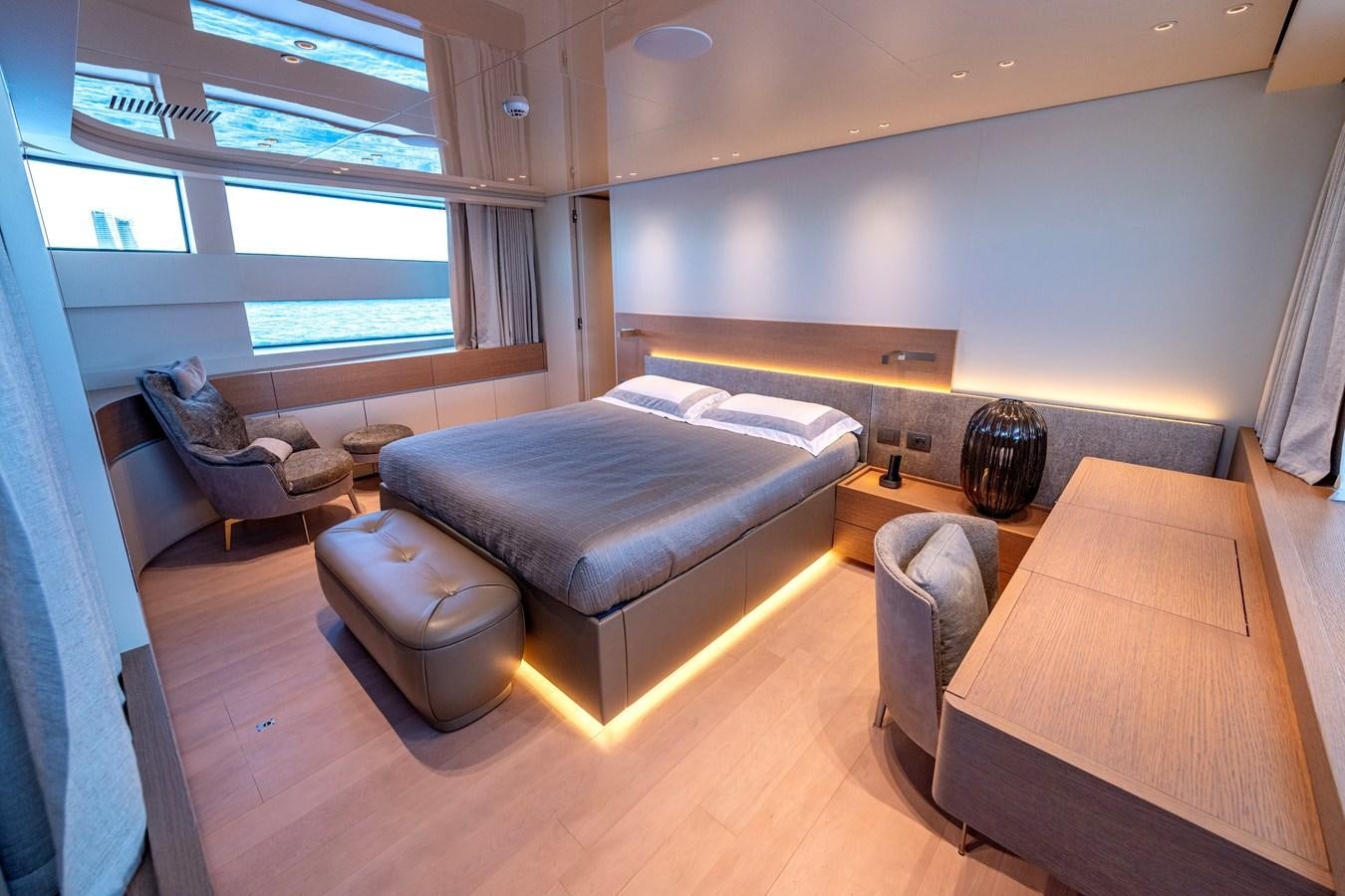 a living room with a couch and a coffee table aboard SPERANZA II Yacht for Sale