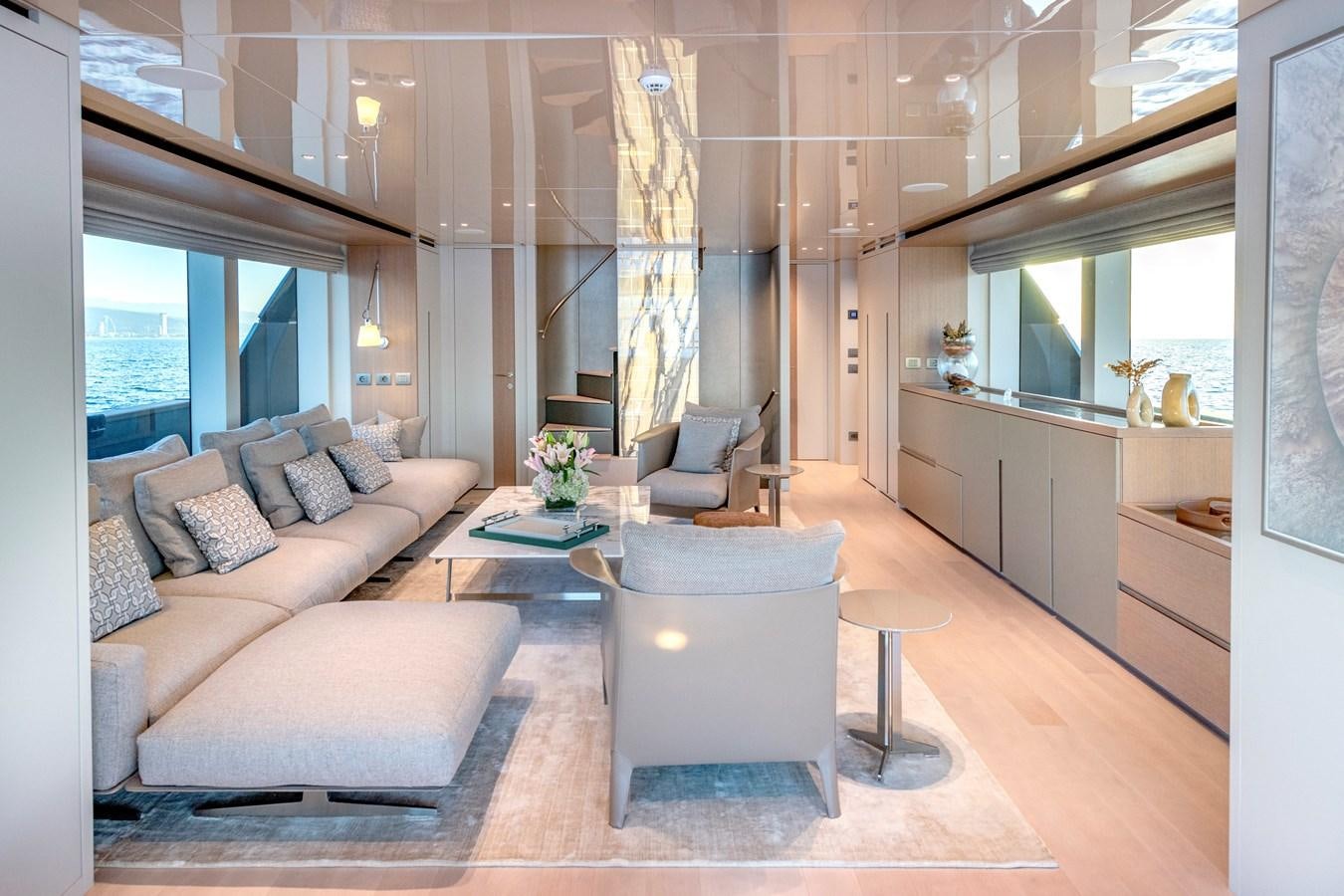 a living room with a couch and a table aboard SPERANZA II Yacht for Sale
