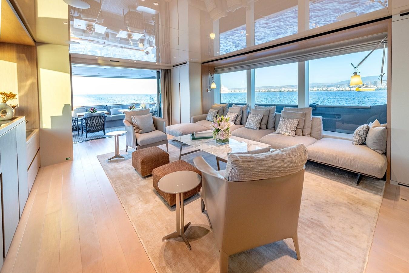 a living room with a large window aboard SPERANZA II Yacht for Sale