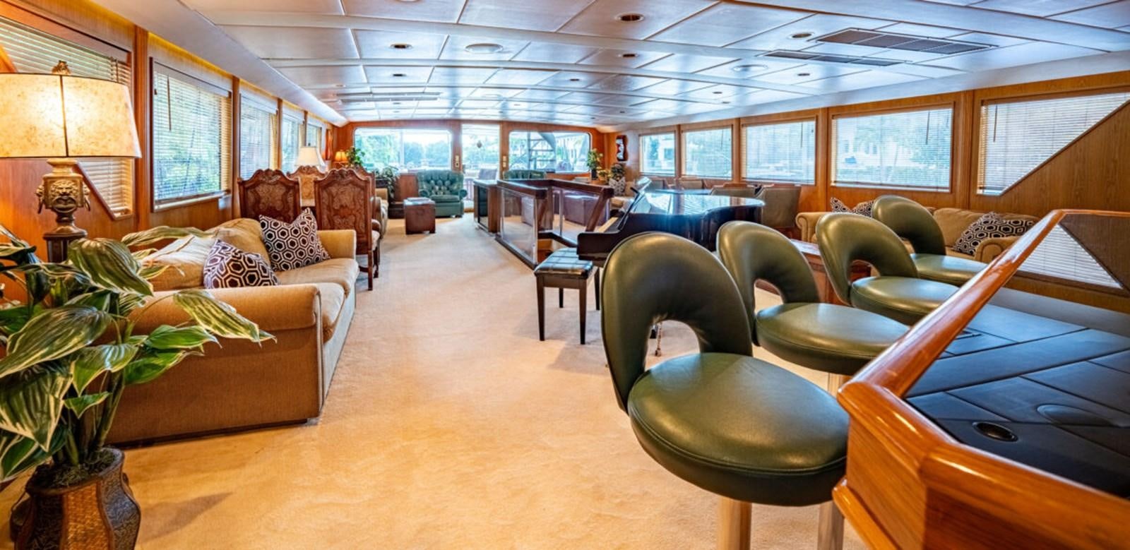 a large room with a piano and a piano aboard LE MONTRACHET Yacht for Sale