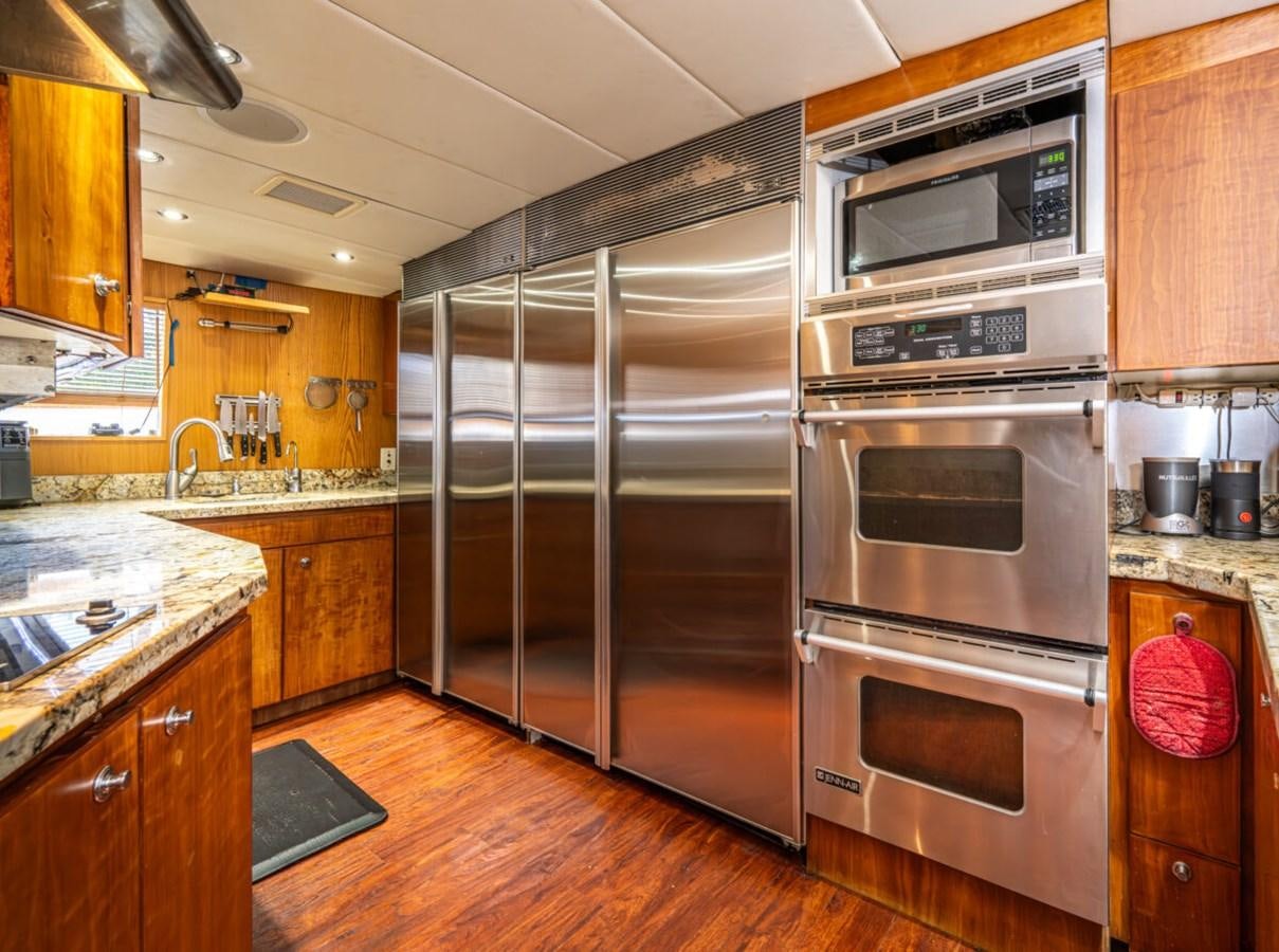 a kitchen with stainless steel appliances aboard LE MONTRACHET Yacht for Sale