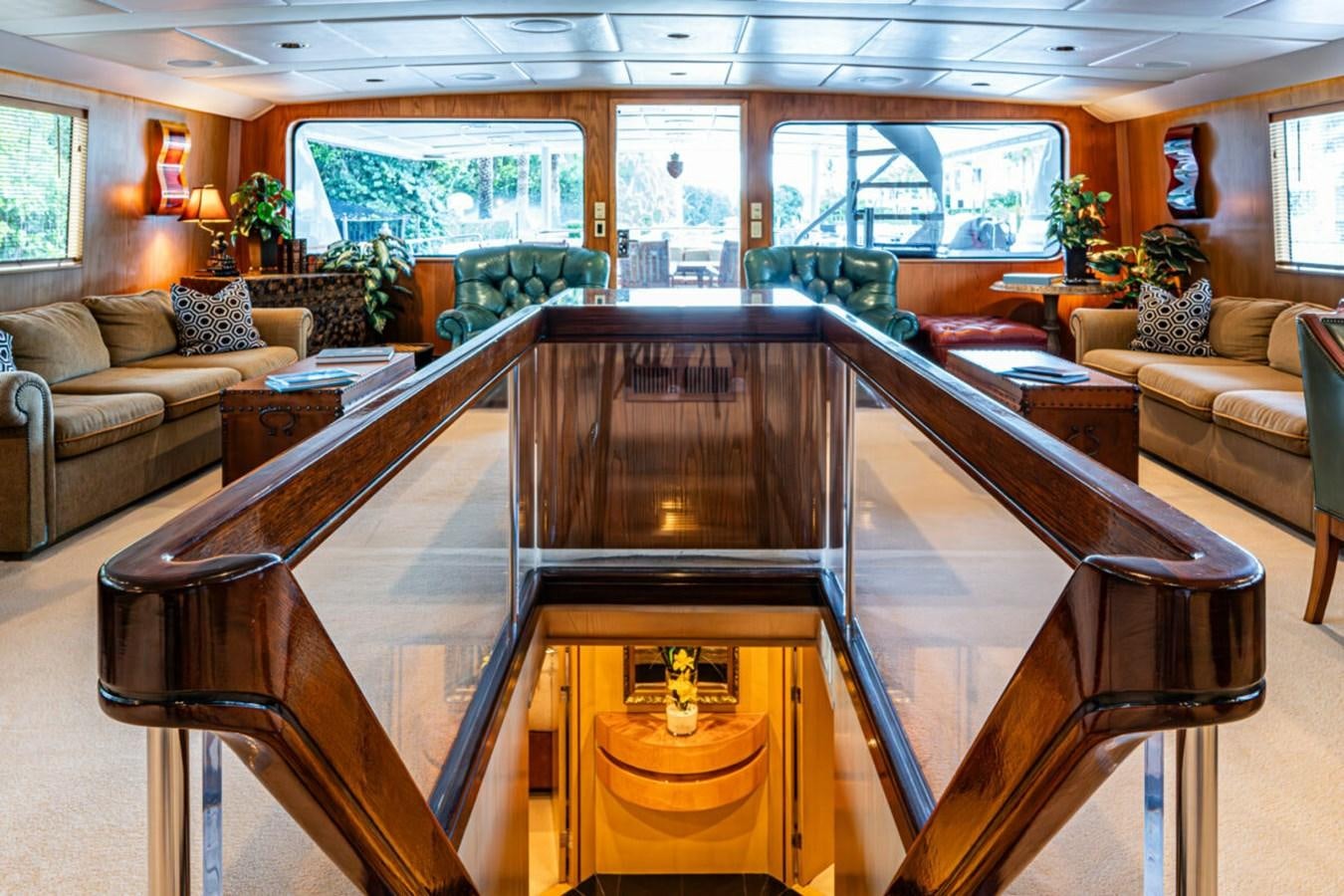 a large room with a table and chairs aboard LE MONTRACHET Yacht for Sale
