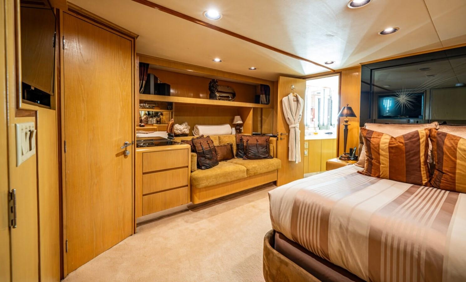 a bedroom with a bed and a closet aboard LE MONTRACHET Yacht for Sale