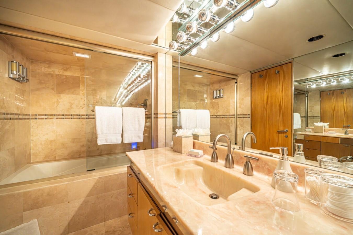 a bathroom with a large mirror aboard LE MONTRACHET Yacht for Sale