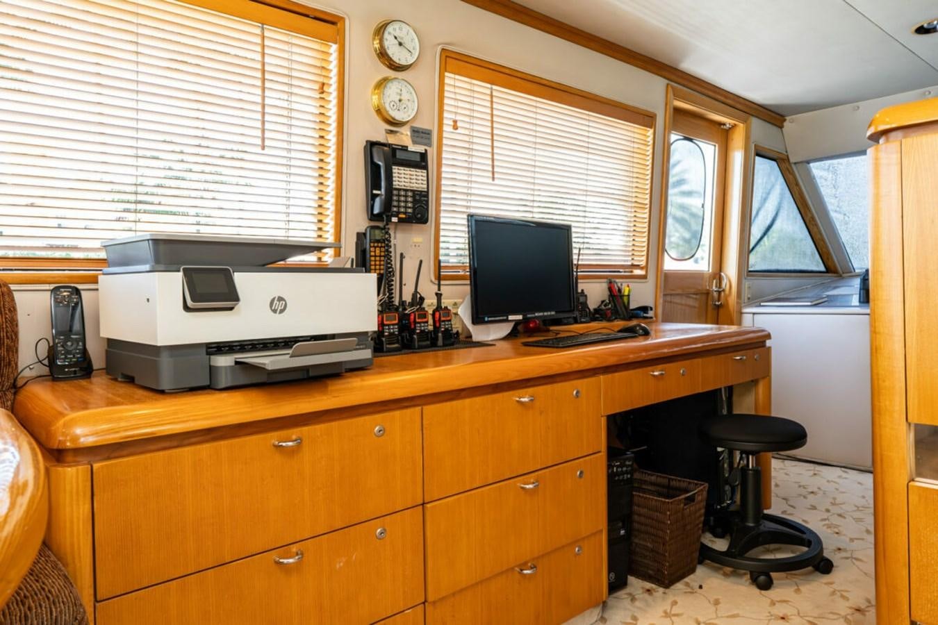 a desk with a computer and printer aboard LE MONTRACHET Yacht for Sale