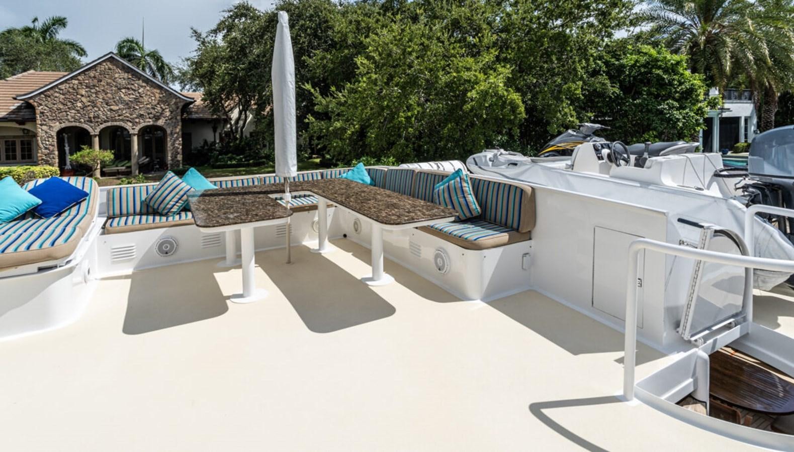 a patio with chairs and tables aboard LE MONTRACHET Yacht for Sale